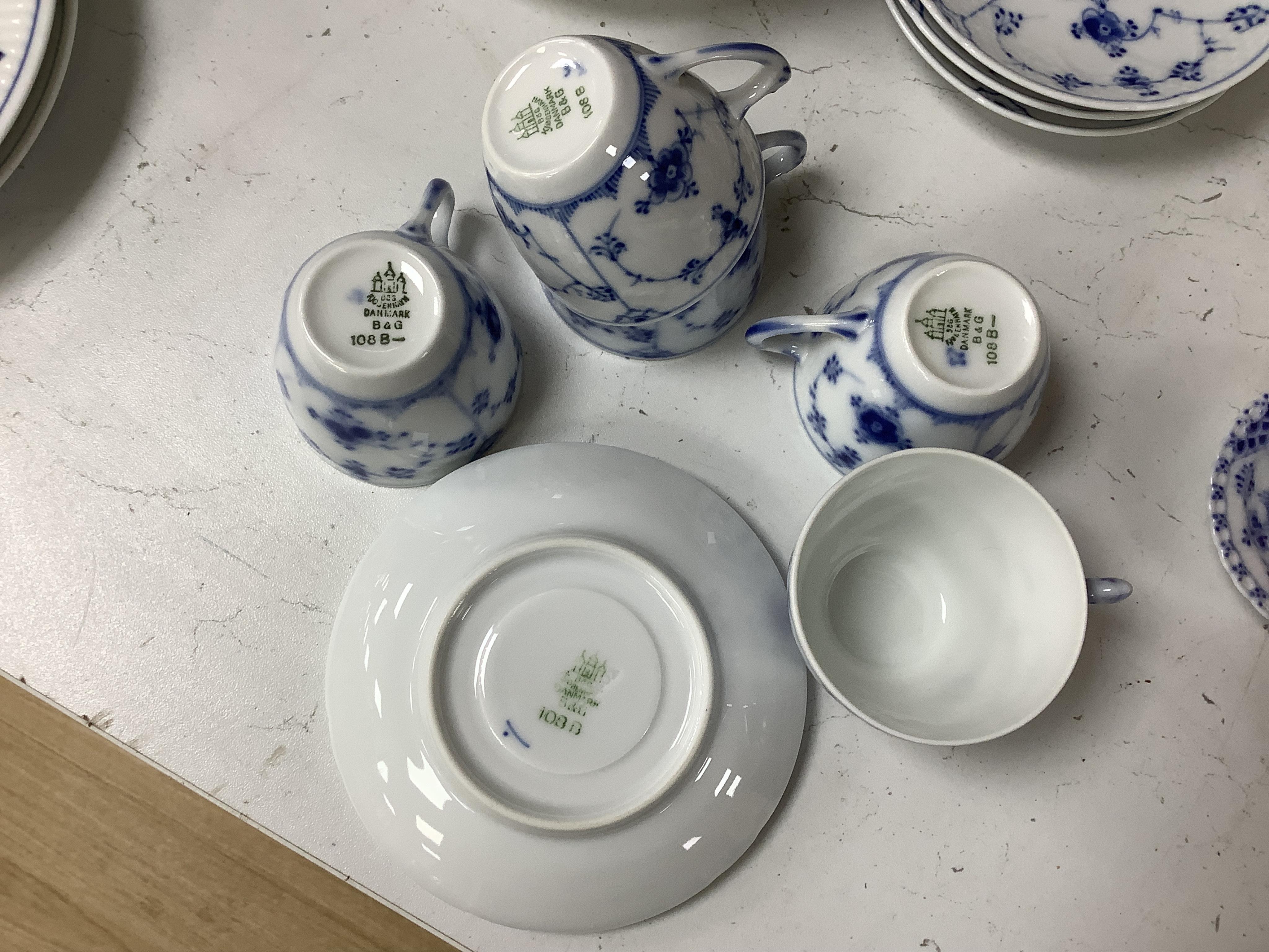 A collection of Royal Copenhagen and Bing & Grondahl onion pattern blue and white tableware